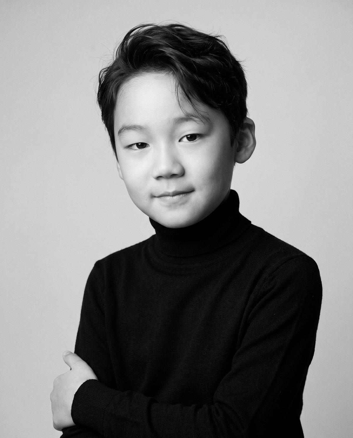 Joshua Shin, black and white portrait in a black turtleneck